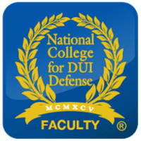 Blue badge featuring a gold laurel wreath surrounding 'National College for DUI Defense' with a gold ribbon that says 'MCMXC' and 'FACULTY'.